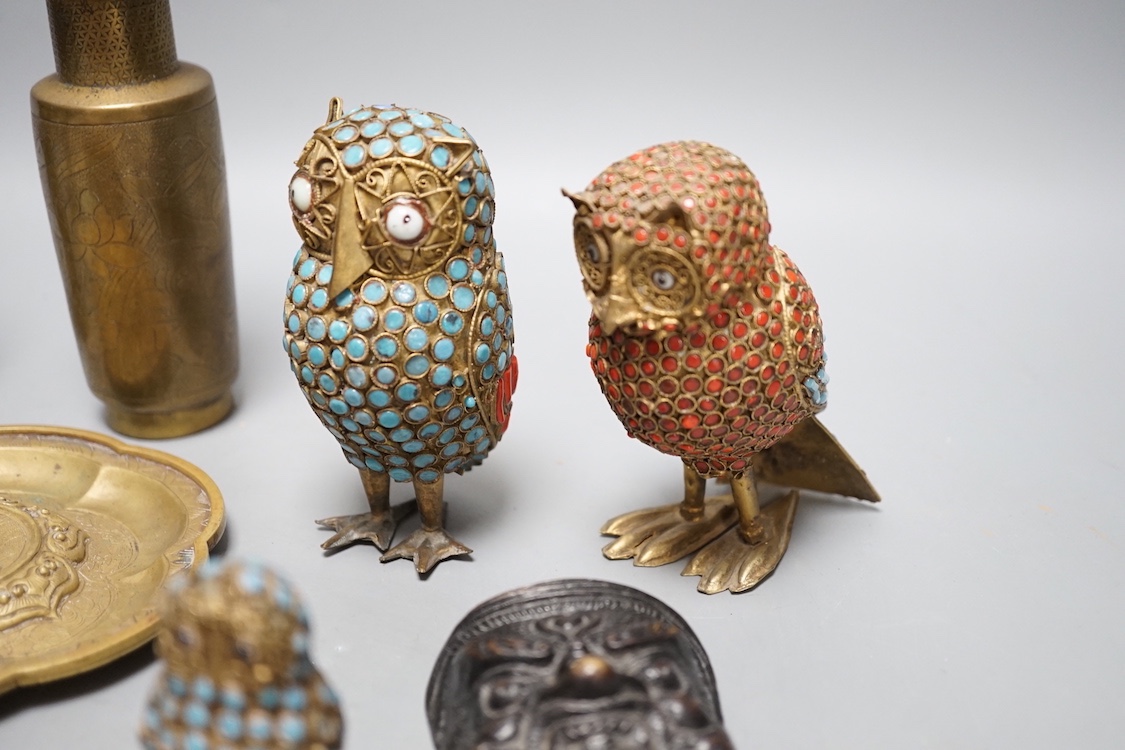 A Chinese water pipe, two Chinese bronze vases, a similar cup stand, a mask, three metal and enamel owl figures and a box